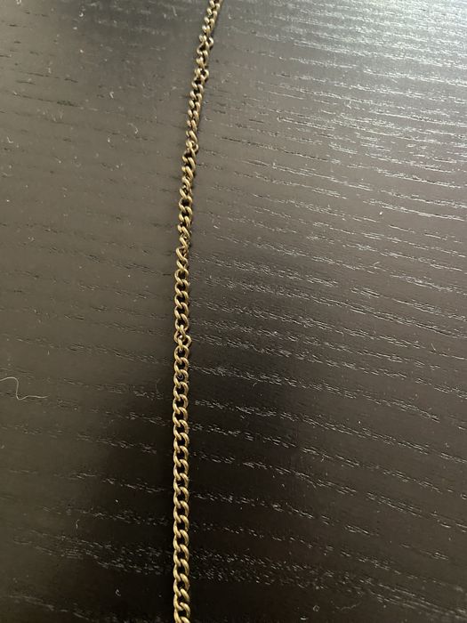 Colar comprido dourado e preto