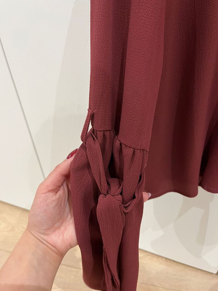 Camisola em tons roxos com manga larga e laços dos lados zona cotovelo