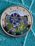 Moeda a cores 2€, flor nacional da Estónia
