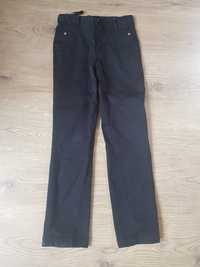 Spodnie jeans rozmiar 140 kolor czarny. Stan bardzo dpbry
