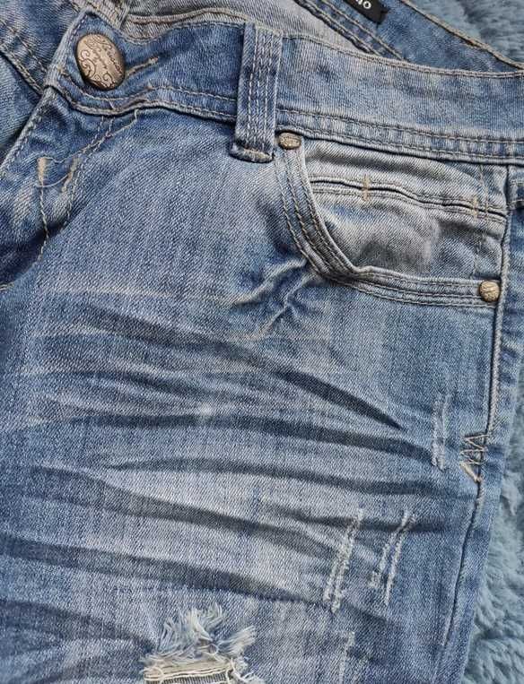Jeansy spodnie z rozdarciami 38