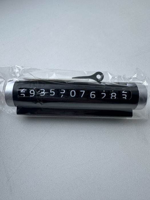 Тимчасова табличка з номером телефону для авто