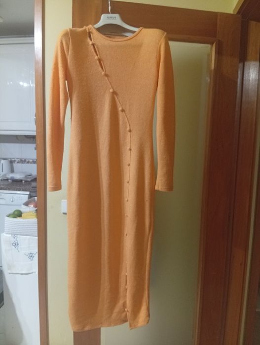 Casacos e mala de senhora