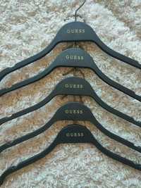 Cabides Guess originais novos.