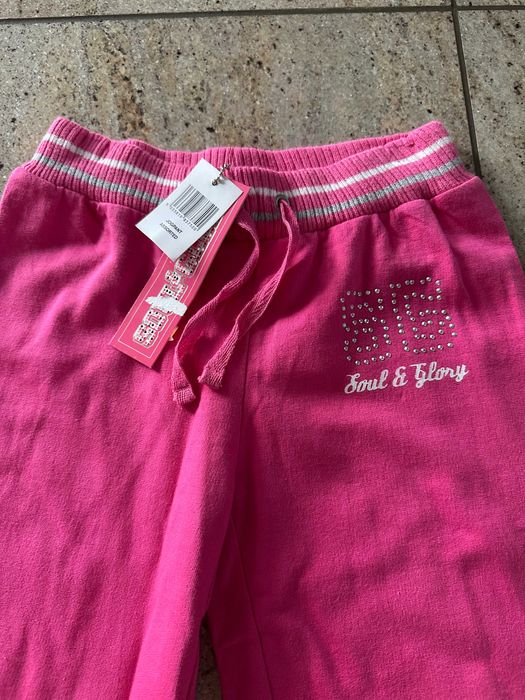 Spodnie dziewczęce dresowe bawełna 140 146 cm  dresy róż