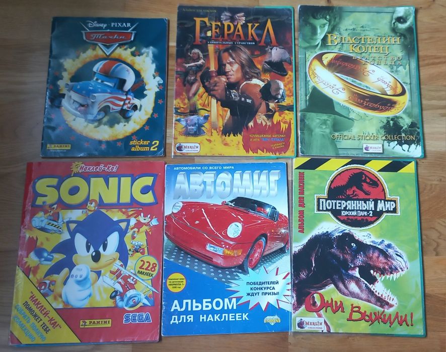 Альбоми з наклейками (panini, topps, merlin)