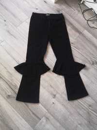 Czarne spodnie dżinsy wysoki stan dzwony z falbanką Asos M 38