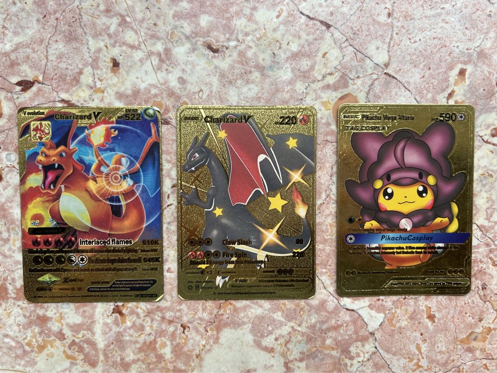 3 zlote karty Pokemon - Pikachu / Charizard + kody to gry