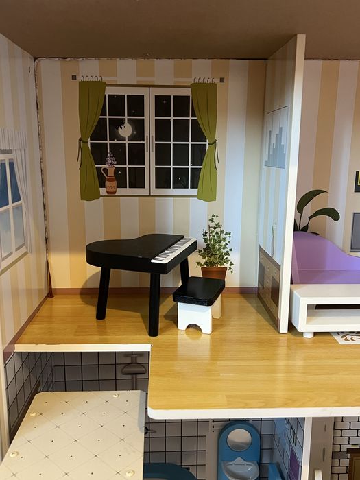 Casa de bonecas em madeira