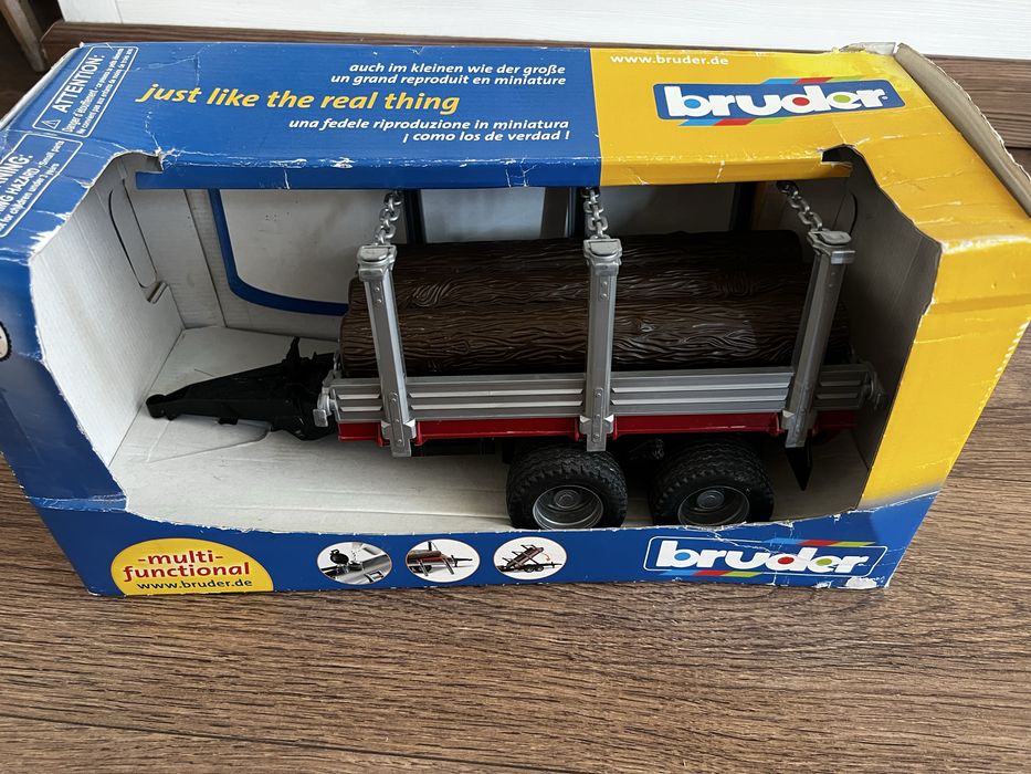 Bruder 02213 przyczepa z drewnem