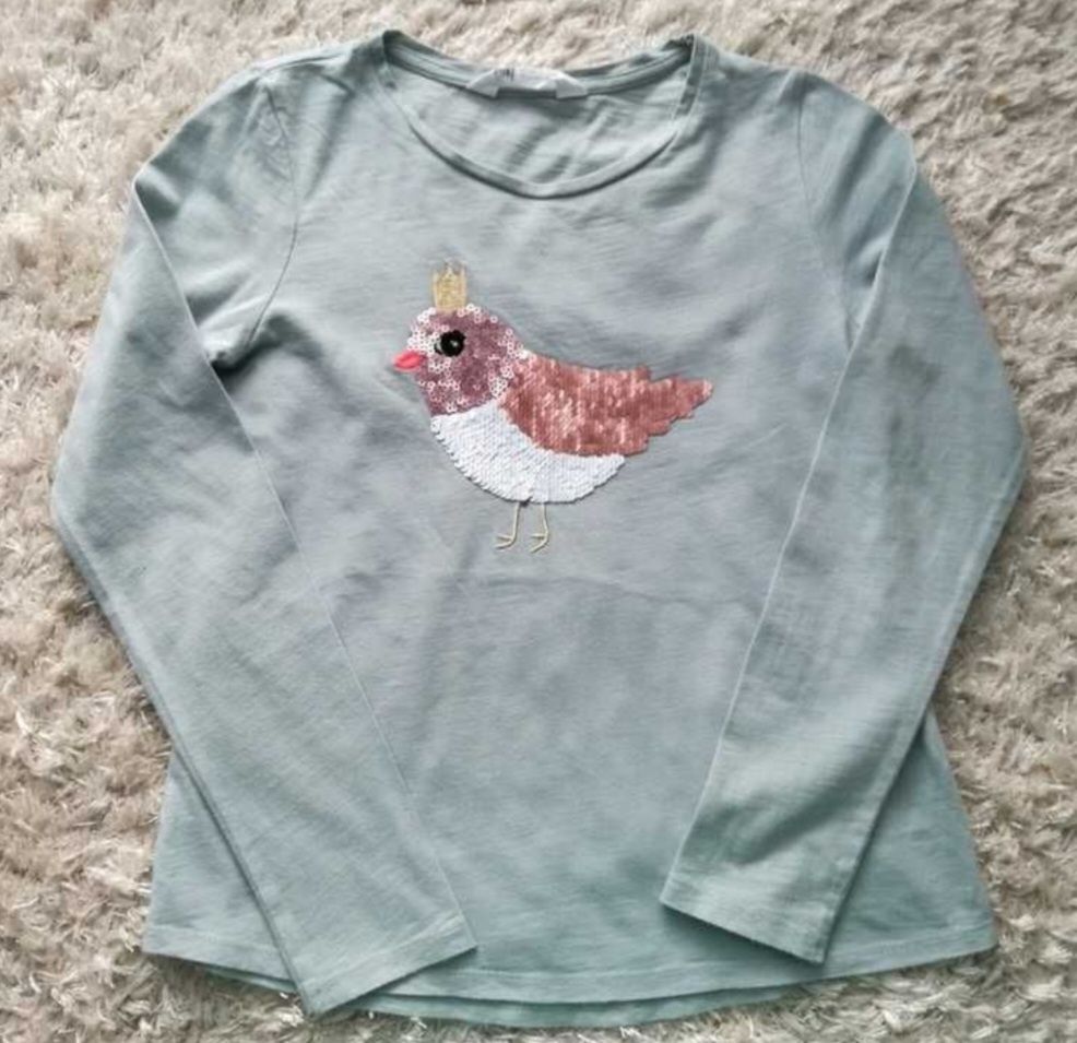 Bawełniana bluzka dziewczęca z ptaszkiem H&M, rozmiar 134/140