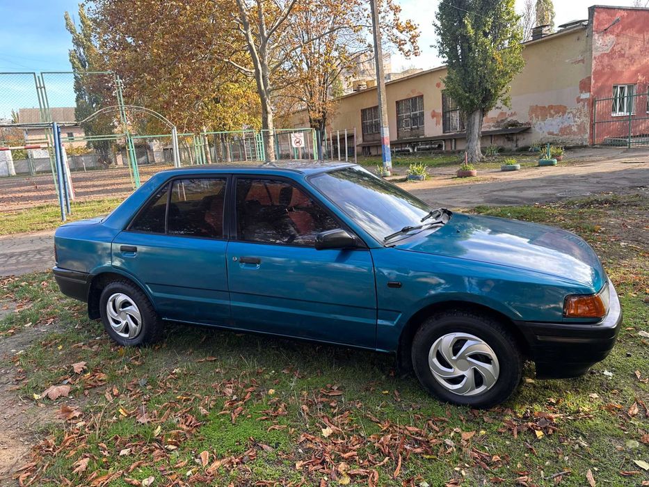 Mazda 323 расход 7л/100км