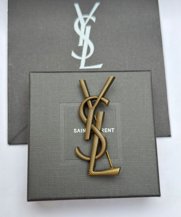 Broszka YSL stare złoto metaliczna