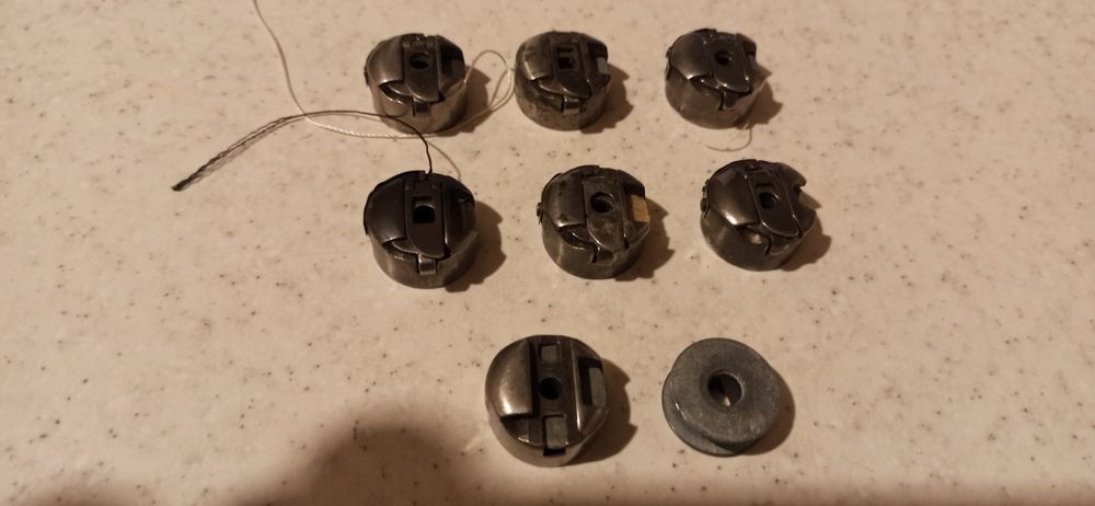 Шпульки, шпульні ковпачки, голки до швейних машин