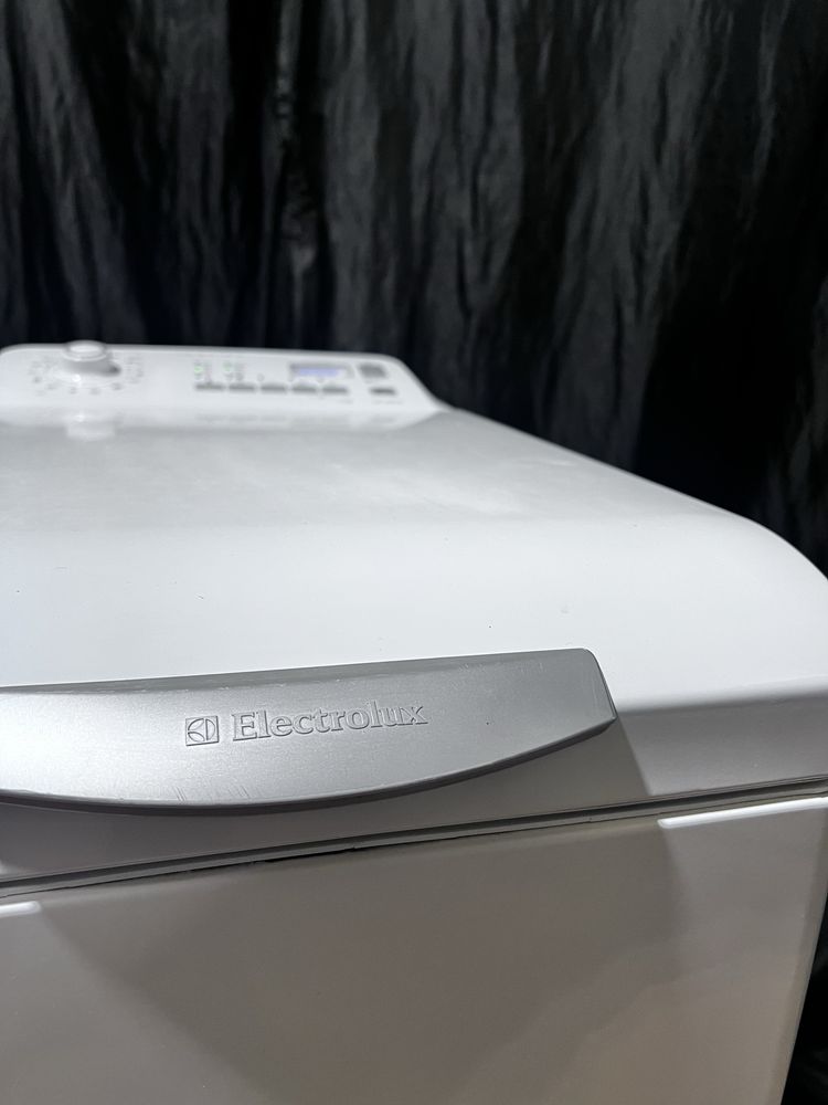 Вертикальная стиральная машина ELECTROLUX ewt10410. Доставка