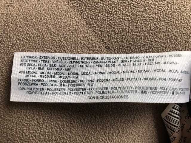 Vestido sem mangas cinzento com decote com aplicações