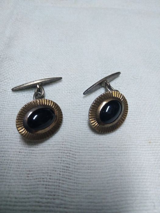 Vários botões de punhos de camisa