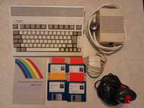 Commodore Amiga 600 A600 + dodatki - dyski, joystick, mysz, zasilacz