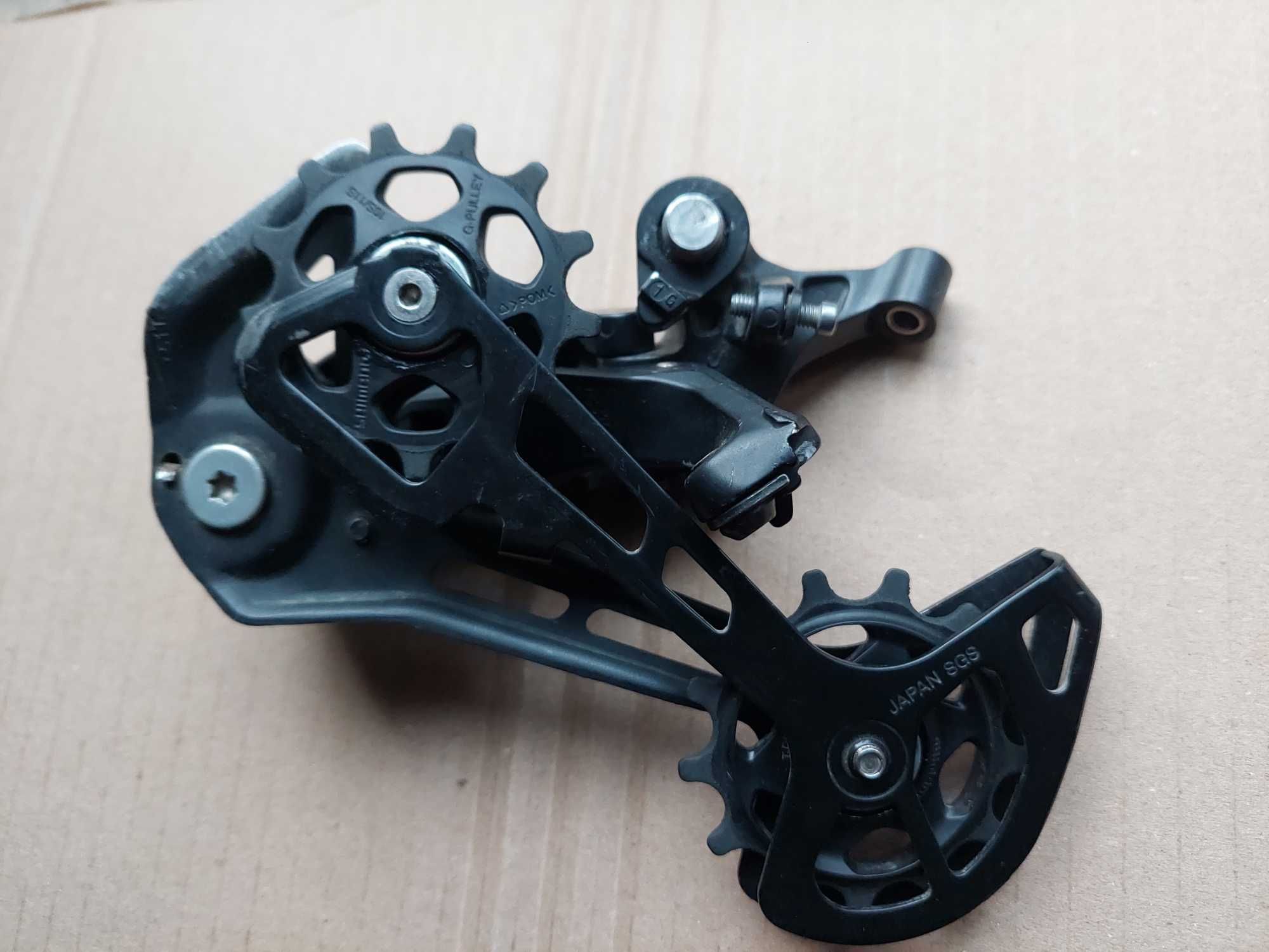 Задній перемикач Shimano Deore RD-M5100 Shadow+,перекидка,mtb.
