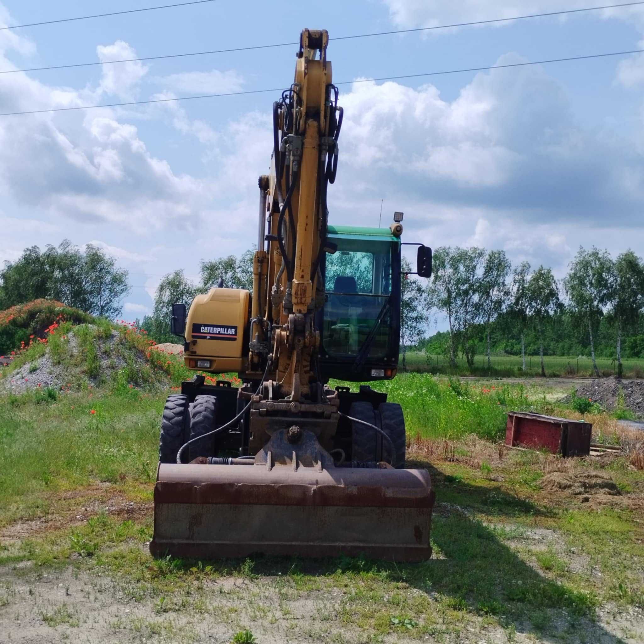 Sprzedam koparkę kołową CATM316C