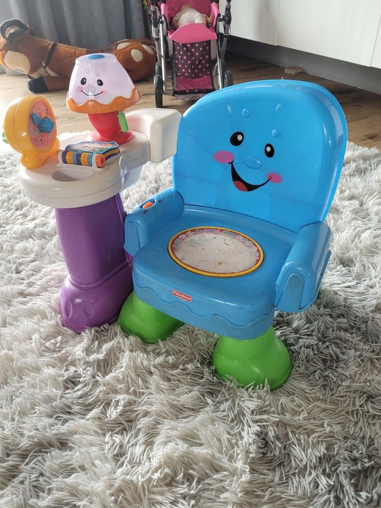 Krzesełko grające fisher price