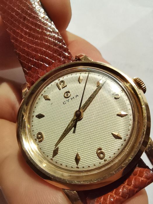 Szwajcarski zegarek Cyma mikrokratka, plaster miodu w 14K złocie