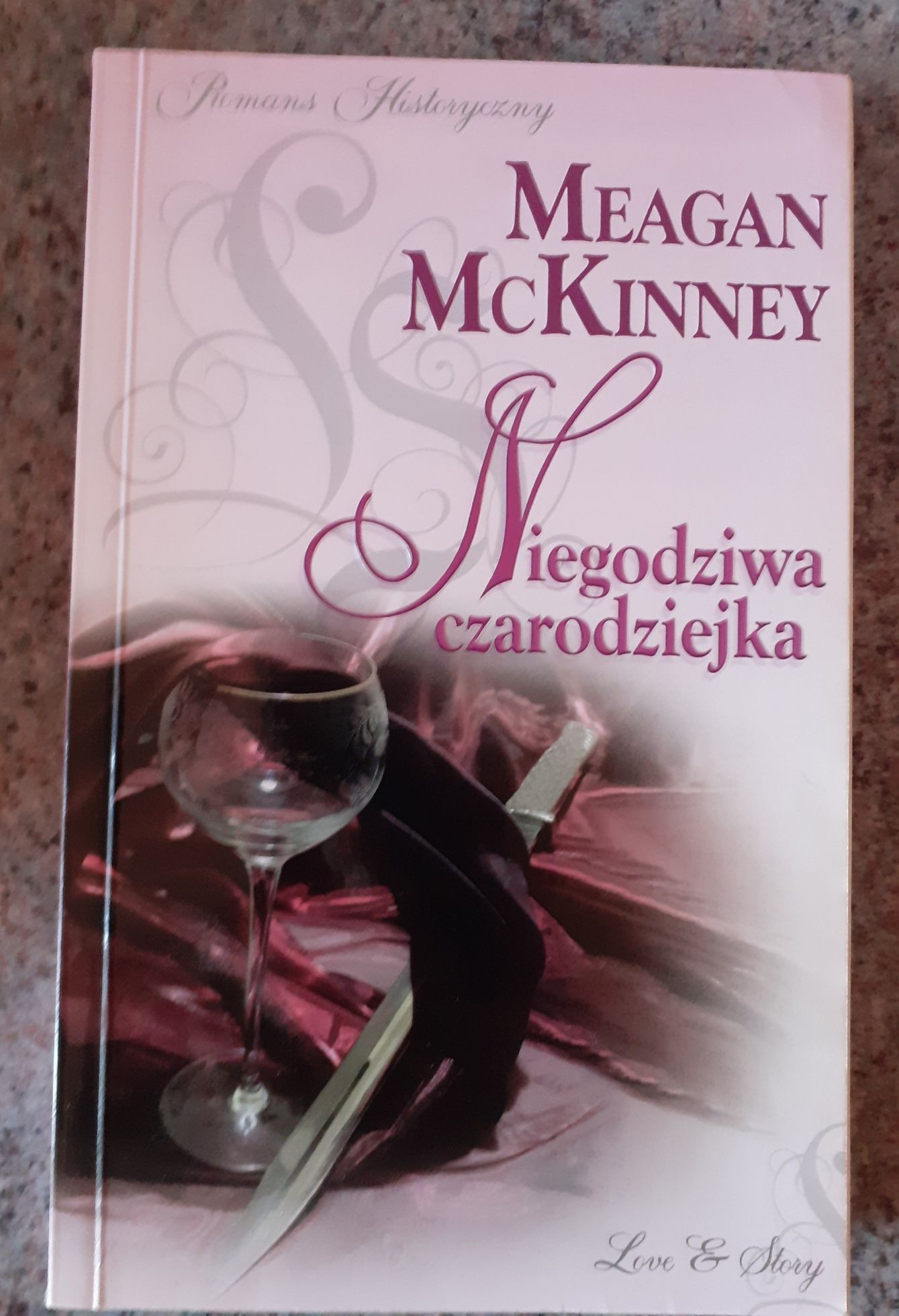 Meagan McKinney - Niegodziwa czarodziejka JAK NOWA (Romans historyczny