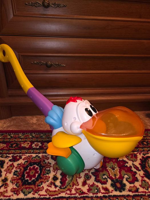 Іграшка музична  каталка Пелікан