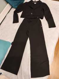 Czarny garnitur dla dziewczynki z szerokimi spodniami 140/146