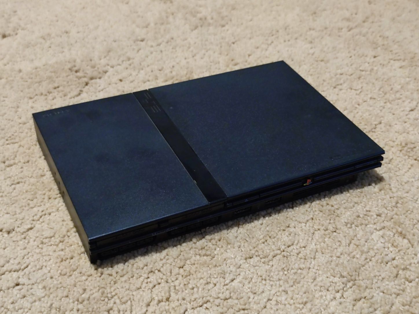 PlayStation 2 Slim + 8 Jogos + Comando + Volante + Cartão de Memória