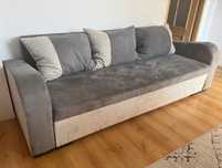 Wygodna szara sofa z funkcją spania