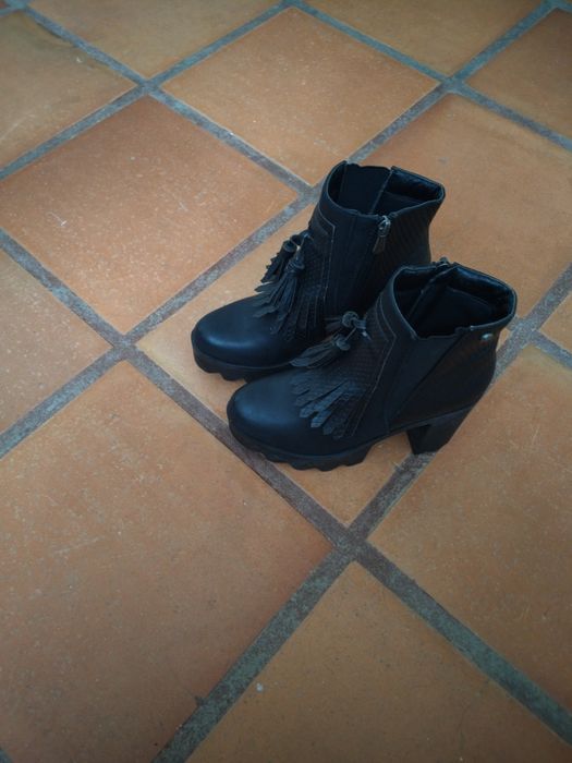 Botas com franjas