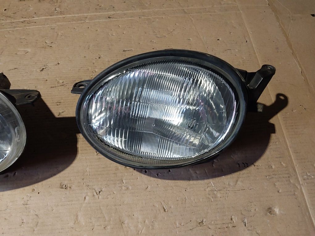 Toyota corolla e 11 lampa przednia przód reflektor prawa lewa prawy