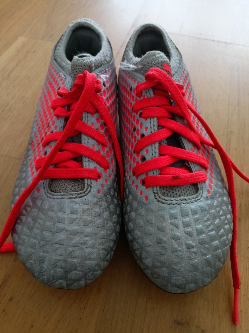 Buty piłkarskie Puma Future 4.4 FG AG JR srebrno-czerwone   r.30