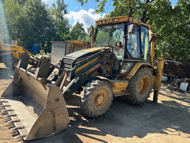 Caterpillar 428D  Caterpilar 428D/autoalarm/GPS/komplet łyżek/mało eksploatowany