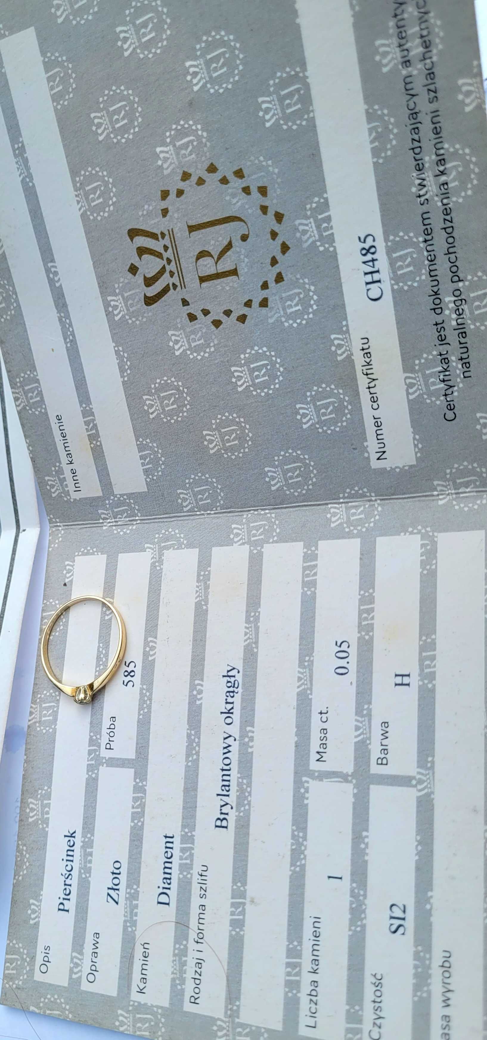 Złoty pierścionek z brylantem