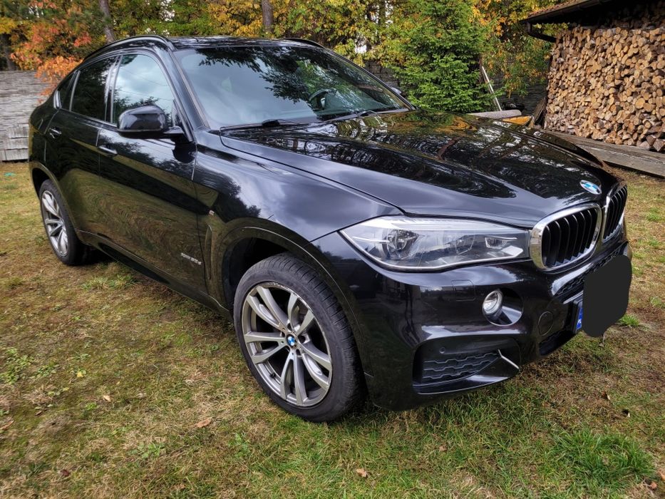 Czarne BMW X6, 3.0 Mpakiet