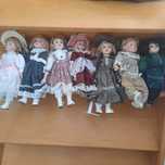 7 Bonecas de porcelana.