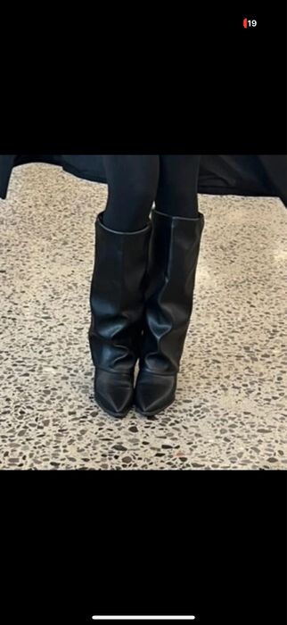 високі чоботи на каблуку