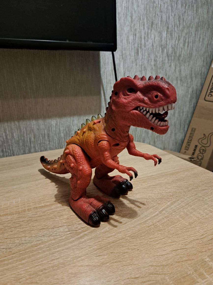 Dinozaur t-rex Tyranozaur Rex chodzi ryczy świeci