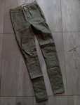 Khaki woskowane jeansy wysoki stan
