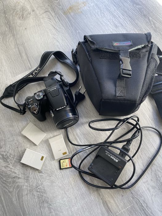 Máquina fotográfica Nikon P100 + bolsa