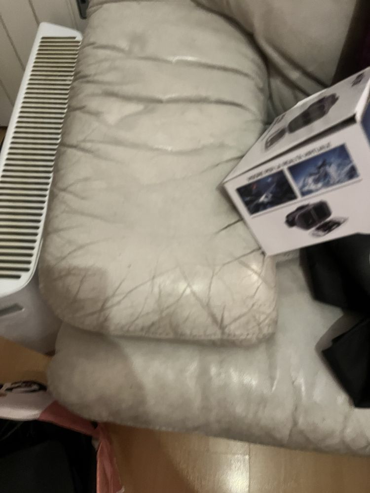 Sofa em pele de canto cinza claro