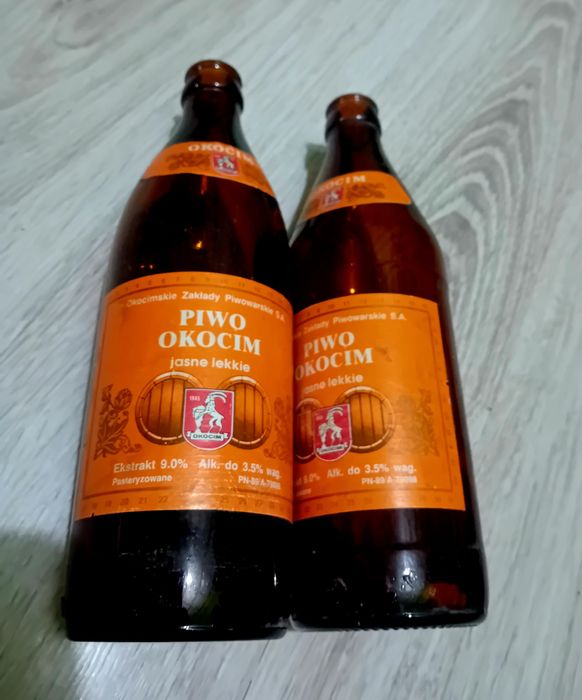 Dwie butelki Okocim z początku lat 90 XXw.