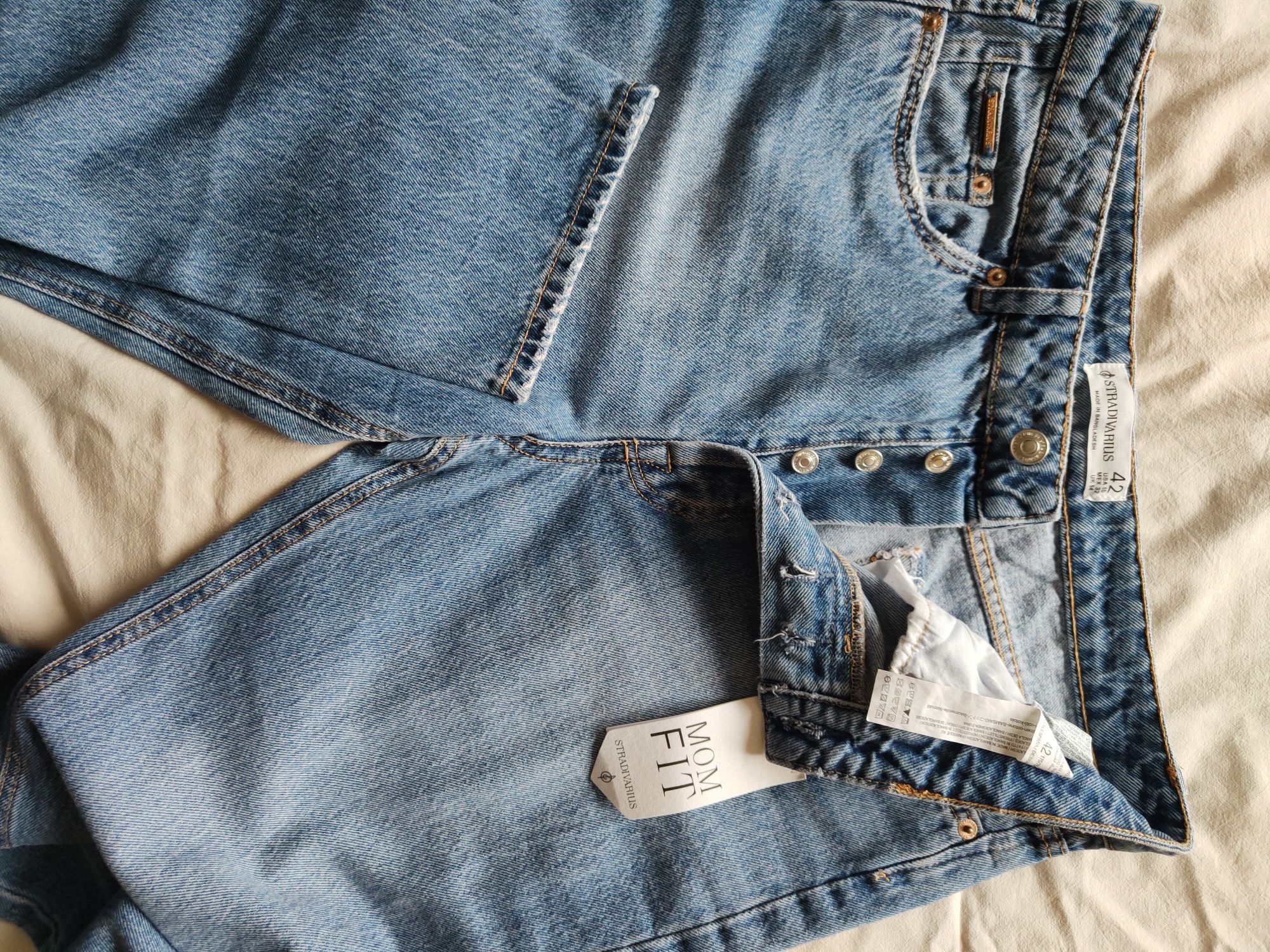 Jeansy zwężane Stradivarius 42 nowe