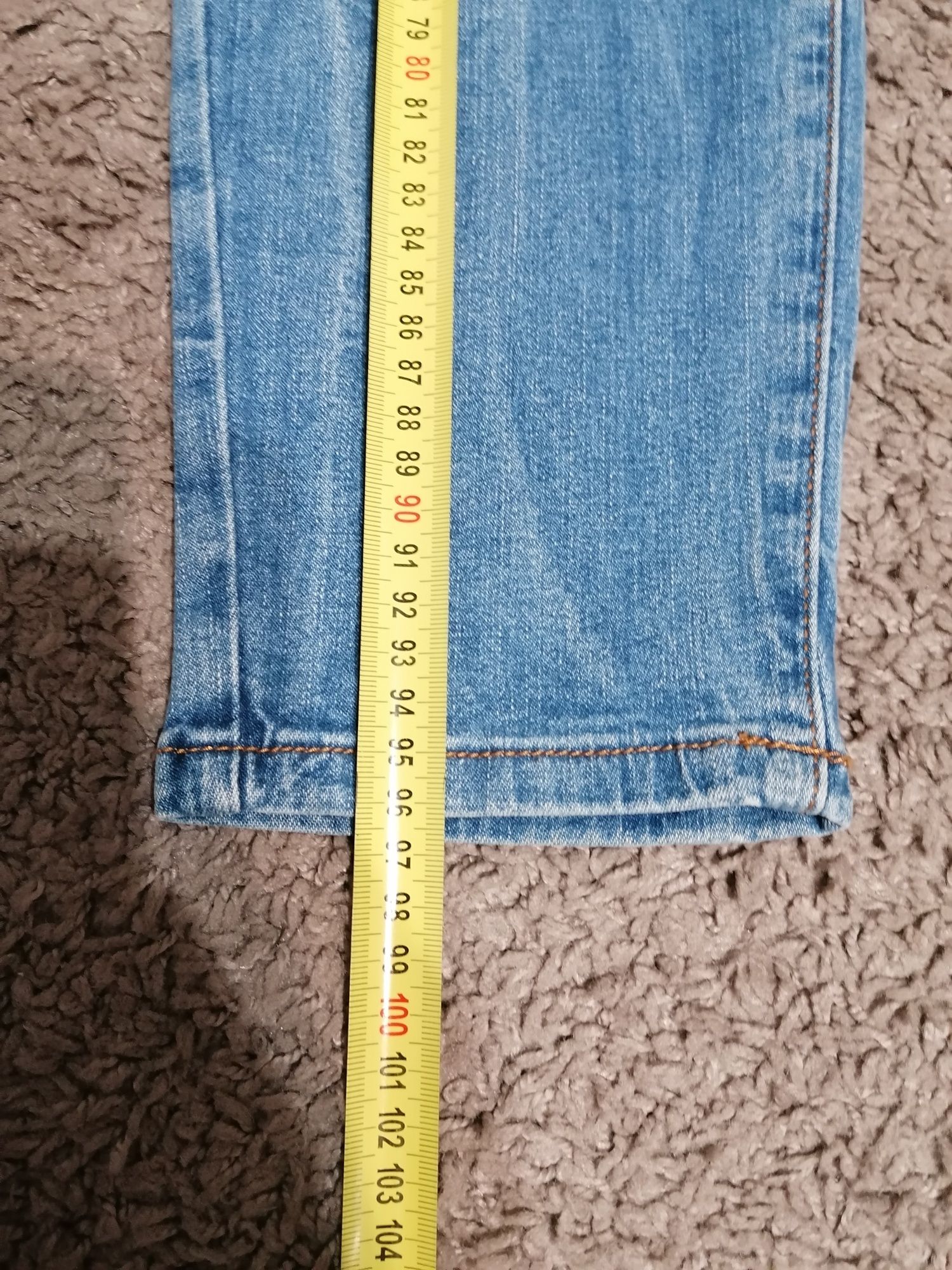 Spodnie jeansowe damskie z dziurami 40