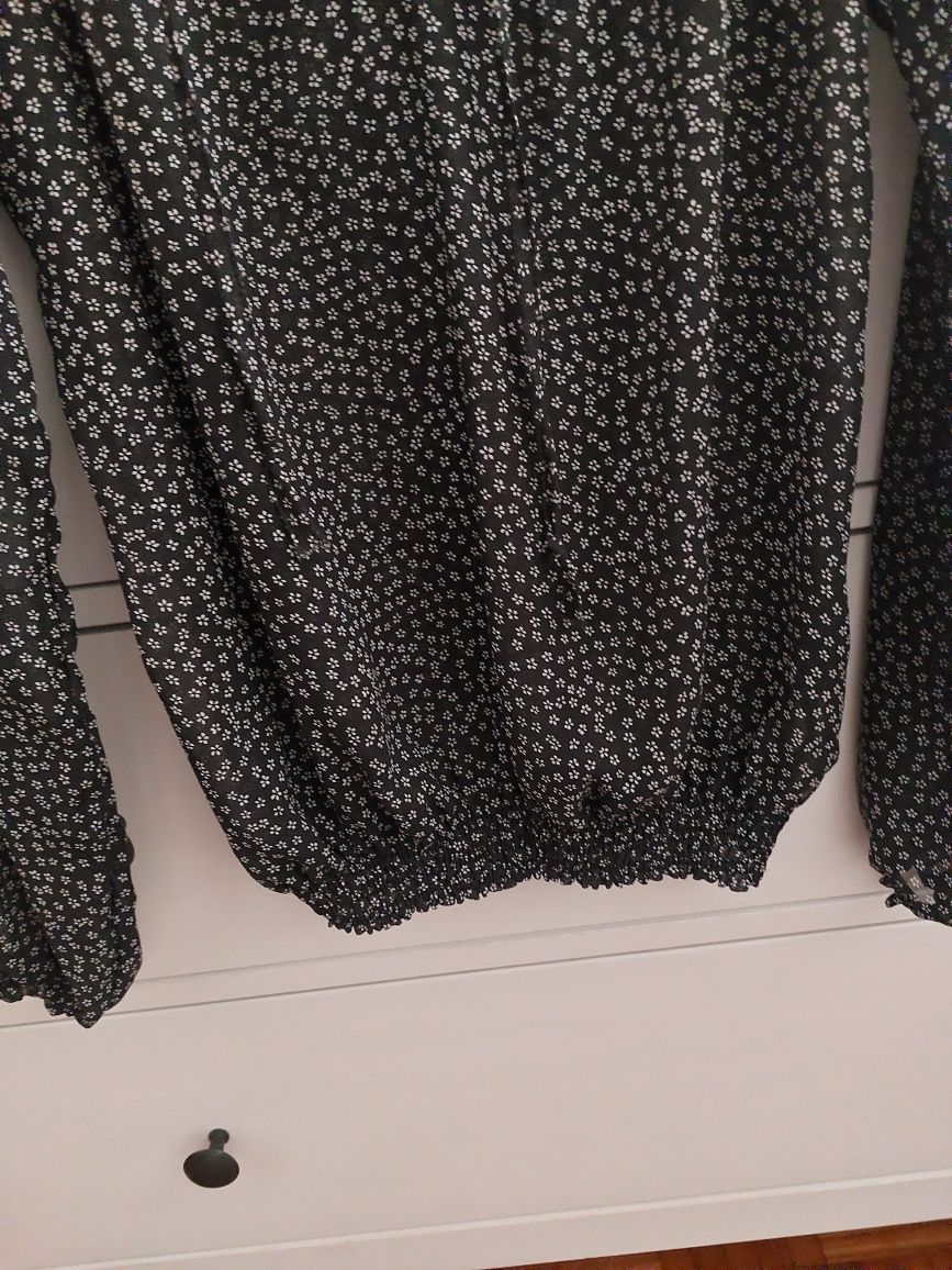 Camisa ombros à mostra