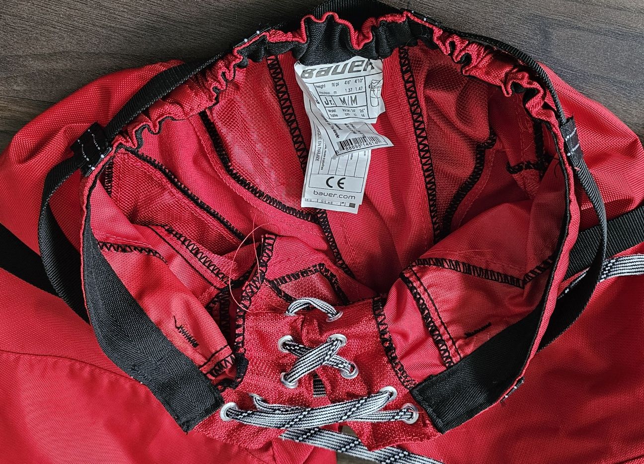 Shell hokejowy Bauer Cover Shell - spodnie hokejowe Jr. M czerwone