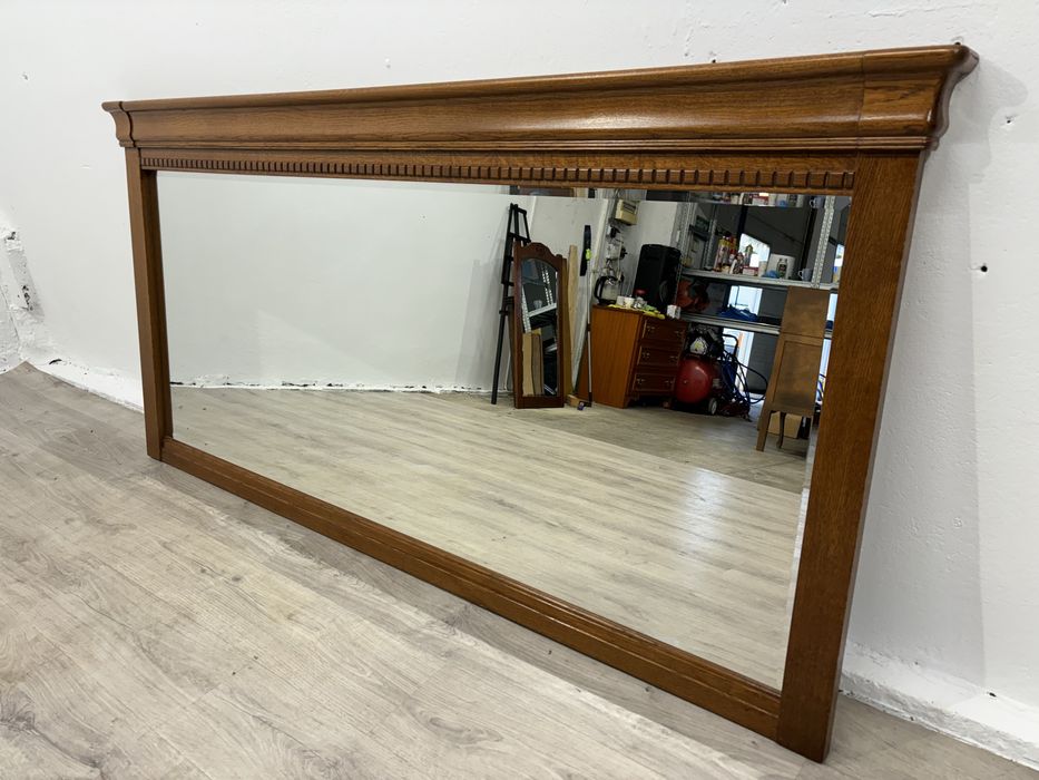 Duże fazowane lustro salonowe w jasnej dębowej oprawie