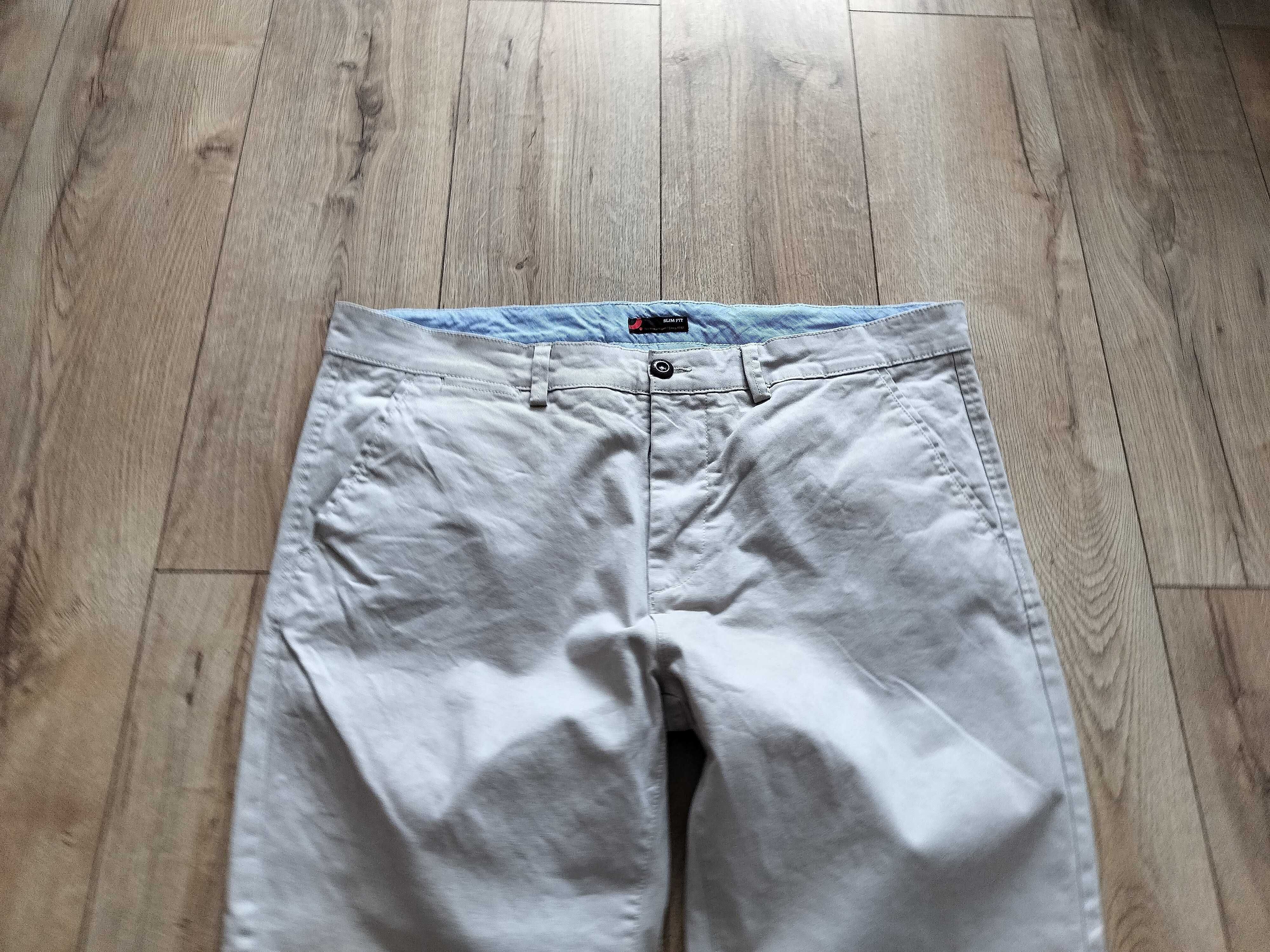 Spodnie męskie 42/32 slim fit oryginalne beżowe elastyczne pas110